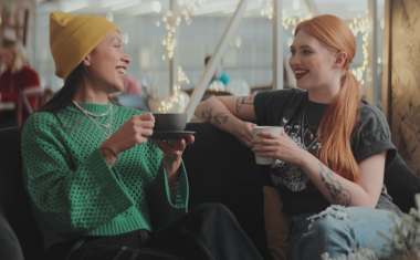 Christmas TV advert scene with two ladies enjoying a coffee at Ori Café